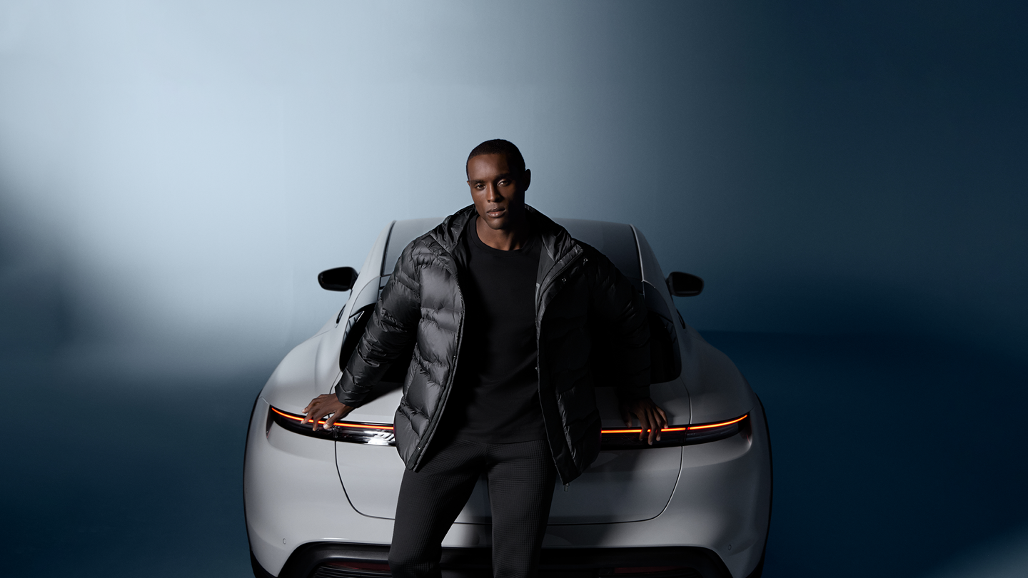 Shows Picture of man-wearing-pd-fashion-porsche-in-back.png